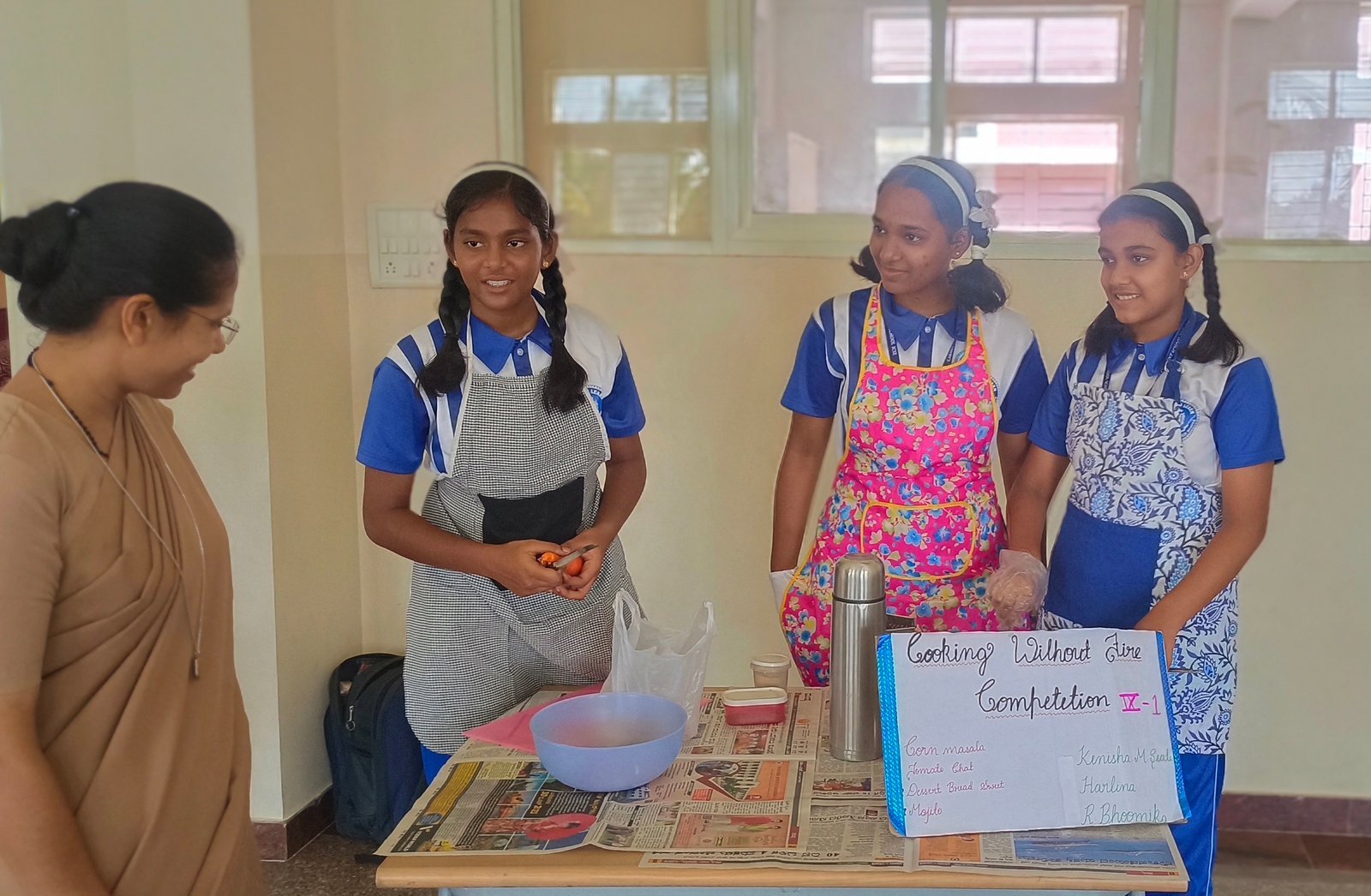 Carmel students sharing their hands-on cooking project with a teacher
