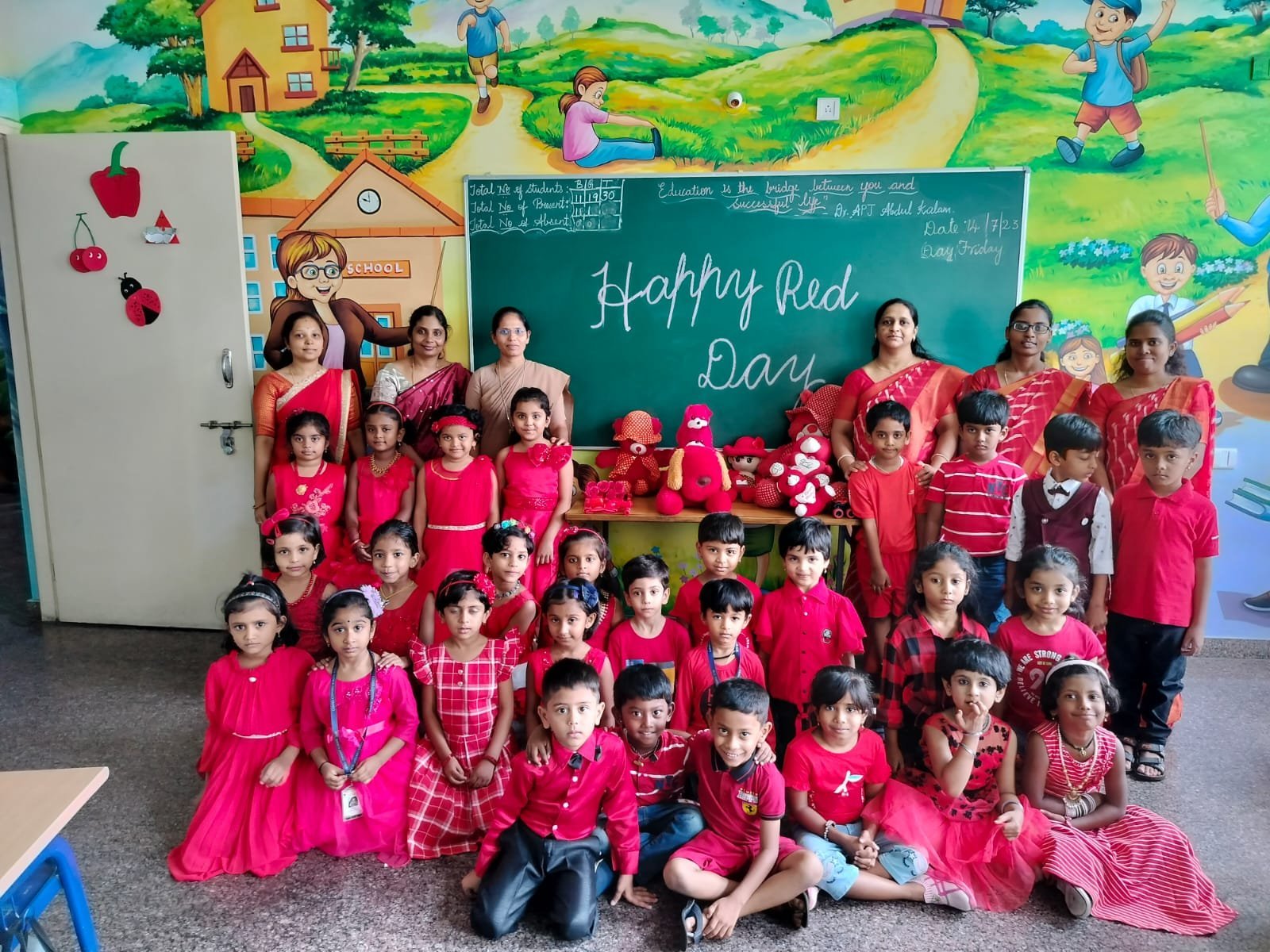 Young students and teachers dressed in red for Red Day